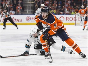 San Jose Sharks' Erik Karlsson (65) tries to catch Edmonton Oilers' Connor McDavid (97) during second period NHL action in Edmonton on Saturday December 29, 2018.