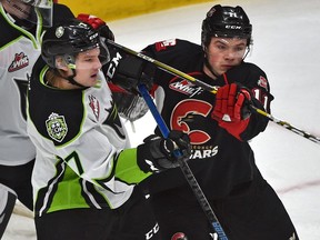 Edmonton Oil Kings Parker Gavlas (7) and  Prince George Cougars Josh Maser (11) battle in front of the net during WHL action at Rogers Place in Edmonton, January 27, 2019. Ed Kaiser/Postmedia