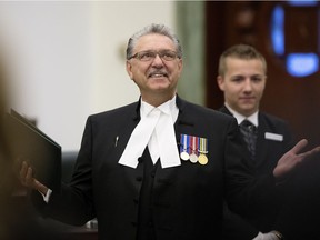Speaker of the Alberta Legislative Assembly Gene Zwozdesky receives a standing ovation after members of the PC caucus are sworn-in at the Alberta Legislature, in Edmonton Alta. on Monday June 1, 2015.