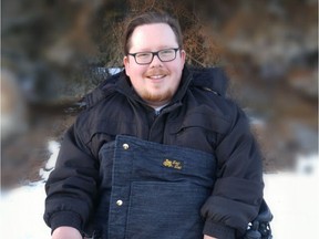 Zachary Weeks shows off an example of the Zac Sac, a cold-weather accessory allowing people in wheelchairs to stay warm in frigid temperatures. For Cam Tait's Edmonton Sun column, Jan. 27, 2019. (Supplied)
