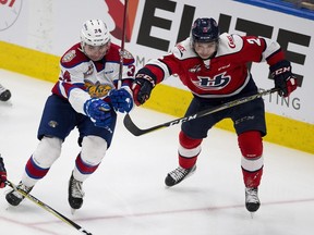 Edmonton Oil Kings Josh Williams (34) and Lethbridge Hurricanes Calen Addison (2) battle fro the puck during first period WHL action on Sunday, Jan. 13, 2019  in Edmonton. Williams scored in a 4-3 shootout loss at the Medicine Hat Tigers on Wednesday.