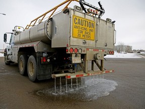 A City of Edmonton truck applies a calcium chloride anti-icing solution to the road in February 2018. Photo by Larry Wong