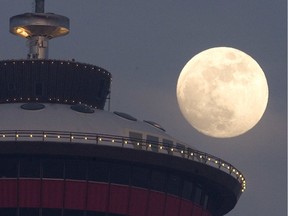 A Super Blood Wolf Moon should be visible over Calgary on Sunday. The rare lunar eclipse is actually a combination of multiple stellar situations playing out at the same time. This file photo shows the nearly full moon rising behind the Calgary Tower on Tuesday February 19, 2018.