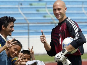 Canadian goalkeeper Lars Hirschfeld, smiles at photographers as he signs authographs for fans 08 October 2004, during a training session in San Pedro Sula, 149 miles (240 Km) north of Tegucigalpa. Canada will face Honduras on 09 September for the Germany 2006 World Cup CONCACAF qualifying round.