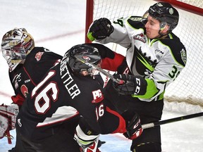 Edmonton Oil Kings Andrew Fyten (39) and Prince George Cougars Ryan Schoettler (16) battle in front of the net during WHL action at Rogers Place in Edmonton, January 27, 2019.