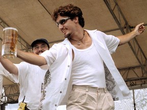 In this Aug. 6, 2000 photo, Justin Trudeau gets inducted into the Order of Saquatch Hunters at the Columbia Brewery's Kokanee Summit Festival held in Creston, B.C.