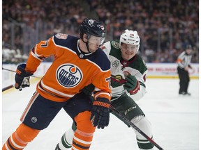 Oscar Klefbom of the Edmonton Oilers, is chased down by Joel Eriksson Ek of the Minnesota Wild at Rogers Place in Edmonton on  Dec. 7, 2018.