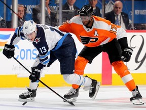 Brandon Tanev #13 of the Winnipeg Jets steals the puck from Wayne Simmonds #17 of the Philadelphia Flyers at Wells Fargo Center on January 28, 2019 in Philadelphia, Pennsylvania.