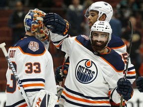 Joseph Gambardella #45 of the Edmonton Oilers and Cam Talbot #33 of the Edmonton Oilers celebrate the Edmonton Oilers 4-0 win over the Anaheim Ducks at Honda Center on January 06, 2019 in Anaheim, California.