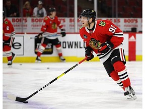 CHICAGO, ILLINOIS - JANUARY 07: Drake Caggiula #91 of the Chicago Blackhawks participates in warm-ups before a game against the Calgary Flames at the United Center on January 07, 2019 in Chicago, Illinois.