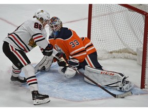 Edmonton Oilers goalie Cam Talbot (33) can't stop Chicago Blackhawks Patrick Kane from scoring in overtime to defeat the Oilers 4-3 during NHL action at Rogers Place in Edmonton, Dec. 29, 2017.