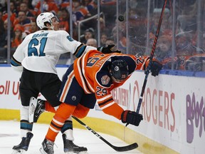 Edmonton Oilers' Leon Draisaitl (29) battles San Jose Sharks' Justin Braun (61) during the first period of a NHL game at Rogers Place in Edmonton, on Saturday, Feb. 9, 2019. Photo by Ian Kucerak/Postmedia