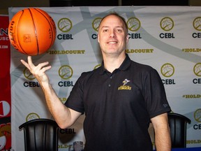 Edmonton Stingers new  head coach and general manager Barnaby Craddock poses after a media conference on Wednesday, Feb. 20, 2019.