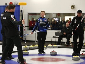 The Leach team (in black) celebrate a winning shot during a game against the Pahl rink at the 2019 Alberta Boston Pizza Cup Men's Curling Championship at Ellerslie Curling Club in Edmonton, on Wednesday, Feb. 6, 2019.