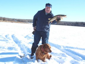 Neil with his "breathless" Devil's Lake pike. Neil Waugh/Edmonton Sun