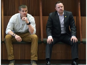 Edmonton Eskimos newly acquired quarterback Trevor Harris (left) sits in the team dressing room at Commonwealth Stadium with general manager Brock Sunderland (right) on Thursday February 14, 2019.