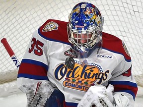 Edmonton Oil Kings goalie Todd Scott bobbles the puck after making the save from a shot by Prince Albert Raiders Noah Gregor (18) during WHL action at Rogers Place on Feb. 4, 2019.