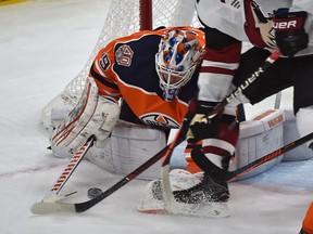 Edmonton Oilers goalie Mikko Koskinen (19) makes the save on Arizona Coyotes Christian Fischer (36) during NHL action at Rogers Place in Edmonton, February 19, 2019.