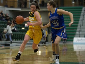 University of Alberta Pandas' Emma Kary (8) battles the University of Lethbridge Pronghorns' Amy Mazutinec (10) during Quarter-final Canada West women's basketball playoffs at the Saville Centre, in Edmonton Thursday Feb. 14, 2019. The Pronghorns won 90-66.