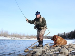 Neil and Penny cast a line for mountain whitefish at the Red Deer River tailwater. Neil Waugh/Edmonton Sun
