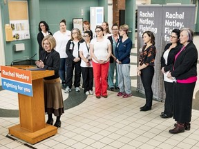 Standing behind a podium and in front of signs which stated "Rachel Notley. Fighting For You" the premier spoke at Lethbridge's Chinook Regional Hospital on Saturday, flanked by nurses as well as Environment Minister Shannon Phillips. (Rachel Notley/Twitter)