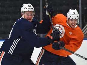 Edmonton Oilers Brad Malone (24) and Kevin Gravel (5) during training camp at Rogers Place in Edmonton, Sept. 18, 2018.