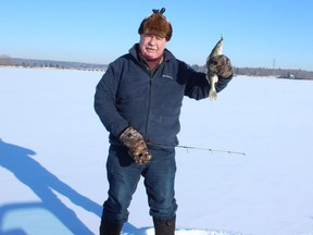 Neil poses with a Lake Wabamun walleye. Neil Waugh/Edmonton Sun