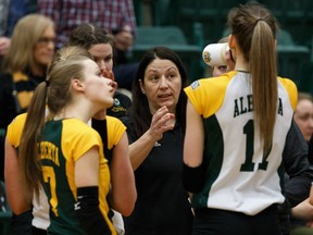 University of Alberta Pandas head coach Laurie Eisler (centre) speaks with her player during a U Sports Volleyball Championship Quarterfinal game versus the University of Toronto's Varsity Blues at Saville Centre in Edmonton, on Friday, March 15, 2019.