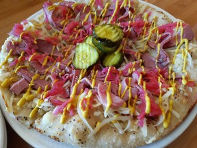 Is the Pink Gorilla's namesake pizza - festooned with pastrami and pink-pickled daikon, colourful enough for you? Photos by GRAHAM HICKS/ EDMONTON SUN