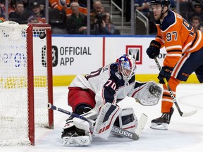 The Edmonton Oilers' Connor McDavid scores on Columbus Blue Jackets' goalie Joonas Korpisalo (70) during third period NHL action at Rogers Place, in Edmonton Thursday March 21, 2019.