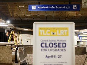 Workers check the lights at Central LRT station in Edmonton, on Monday, March 25, 2019. The station is slated for closure for upgrades from April 6-27. Photo by Ian Kucerak/Postmedia