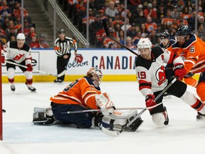 Edmonton Oilers goaltender Mikko Koskinen (19) is scored on by New Jersey Devils' Travis Zajac (19) during the first period of a NHL game at Rogers Place in Edmonton, on Wednesday, March 13, 2019.