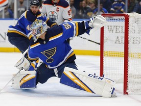 St. Louis Blues' goalie Jordan Binnington (50) makes a save against the Edmonton Oilers during the first period of an NHL hockey game Tuesday, March 19, 2019 in St. Louis.