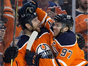 The Edmonton Oilers' Zack Kassian (44) an Connor McDavid (97) celebrate a third period goal against the Columbus Blue Jackets during third period NHL action at Rogers Place, in Edmonton Thursday March 21, 2019.