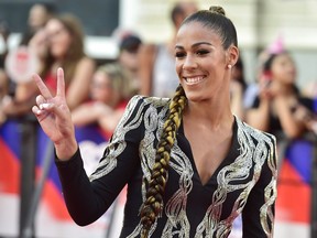 Canadian WNBA player Kia Nurse arrives on the red carpet at the iHeartRadio MMVAs in Toronto on August 26, 2018. Kia Nurse glammed it up on the red carpet at last week's iHeartRadio MMVAs. She spent a day last month inspiring a group of young women at a downtown Toronto court that Nike had dressed up with a huge billboard in her honour.The star of Canada's women's basketball team hopes her example will spark the dreams of young girls. Yet she worries about the relative anonymity of the WNBA, the world's best women's league that many will never get to watch. "I could become virtually irrelevant in a couple of years because no-one sees me play anymore," Nurse said. The star guard from Hamilton joined Canada's national team this week ahead of the women's World Cup.