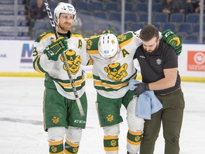 University of Alberta forward and 2019 U-Sports men's hockey player of the year Luke Philp is helped off the ice with a knee injury midway through the first period of a 4-2 loss to the University of New Brunswick Reds in the national championship final Sunday, March 17, 2019, in the Enmax Centre in Lethbridge, AB.