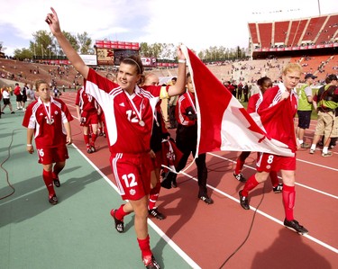 Edmonton Alta. Sept. 1, 2002. Team Canada's Christine Sinclair acknowledges the crowd at Commonwealth Stadium.  The Canadian national team ran a lap around the field after losing to the United States 1-0 in extra time in the gold medal game of FIFA U-19 Women's World Soccer Championships. Perry Mah/Edmonton Sun