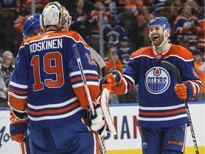Edmonton Oilers goalie Mikko Koskinen (19) and Zack Kassian (44) celebrate the win over the Vancouver Canucks'during third period NHL action in Edmonton, Alta., on Thursday March 7, 2019.