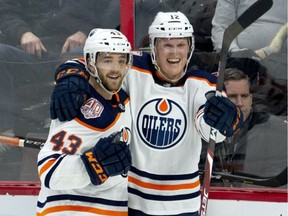 Edmonton Oilers centre Colby Cave(12) celebrates his goal with teammate Josh Currie during third period NHL action against the Ottawa Senators, in Ottawa, Thursday, Feb. 28, 2019. The Oilers defeated the Senators 4-2.
