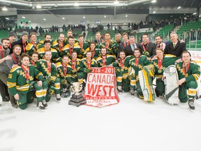 The University of Alberta Golden Bears celebrate winning their 28th Canada West men's hockey championship with a team photo on the ice following a 1-0 win over the University of Saskatchewan Huskies at Saskatoon's Merlis Belsher Place on Sunday, March 3, 2019.