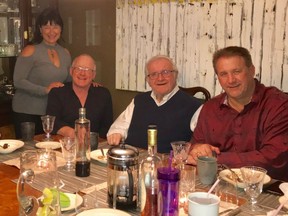 Doris Gunter, left, and Lorne Gunter with Al Korchinski and Jerry Korchinski, top bidders on a dinner in the ATCO Edmonton Sun Christmas Charity Auction, enjoying coffee after dinner in the family's dining room.