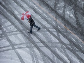 Snow or rain? Probably a bit of both and a thunderstorm to boot on Thursday, says Environment Canada.