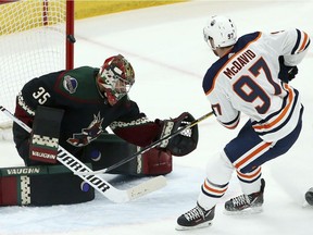 Edmonton Oilers center Connor McDavid (97) scores a short-handed goal against Arizona Coyotes goaltender Darcy Kuemper (35) during the first period of an NHL hockey game Saturday, March 16, 2019, in Glendale, Ariz.