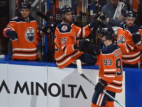 Edmonton Oilers Ryan Nugent-Hopkins (93) gets congratulated by teammates after scoring a hat trick in the first period against the Los Angeles Kings during NHL action at Rogers Place in Edmonton, March 26, 2019.