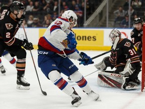 Edmonton Oil Kings' Liam Keeler (12) breaks his stick on a shot on Calgary Hitmen's goaltender Jack McNaughton (31) during the third period of a WHL hockey game at Rogers Place in Edmonton, on Saturday, March 16, 2019.