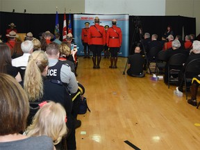 RCMP members gather with family and friends at the K division headquarters on Wednesday. Submitted