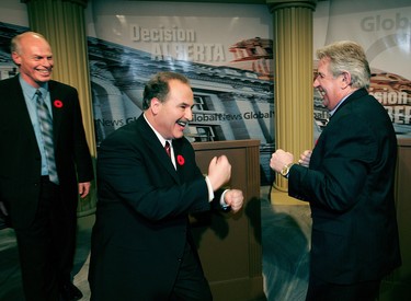 November 8, 2004. NDP leader Brian Mason (c) and Premier Ralph Klein play fight with each other with Liberal leader Kevin Taft watching after finishing the Alberta leaders debate at Global Television Studios. The leaders verbally sparred with each other for over an hour in Edmonton November 8, 2004.  Perry Mah Edmonton Sun