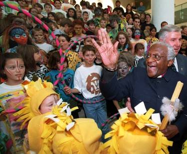 Archbishop Desmond Tutu waves to school children from St. Richard Catholic Elementary who performed songs from the Lion King at City Hall. Tutu was in town for the UN Human rights conference on Nov. 27, 1998. While in town Tutu stayed at the Fairmont Hotel Macdonald. Perry Mah/Edmonton Sun/Postmedia Network