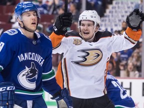 Anaheim Ducks' Sam Steel, right, celebrates teammate Kiefer Sherwood's goal as Vancouver Canucks Ashton Sautner skates past during the third period of an NHL hockey game in Vancouver, on Tuesday March 26, 2019.