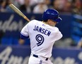 Blue Jays' Danny Jansen swings and misses during Tuesday night's game against Baltimore. (BRYAN PASSIFUME/Toronto Sun)